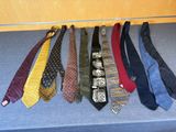 many ties that are lined up on a table
