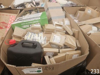 many boxes of assorted items in a pile