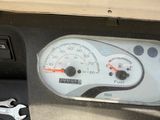 a close up of a speedometer in the dashboard of a car