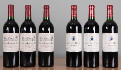 six bouteilles de vin rouge sont alignées sur une table