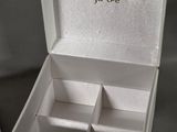 a white box that has four compartments inside of it
