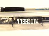 two pens and a pen holder sitting on a table