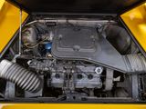 a close up of a car ' s engine with the hood open