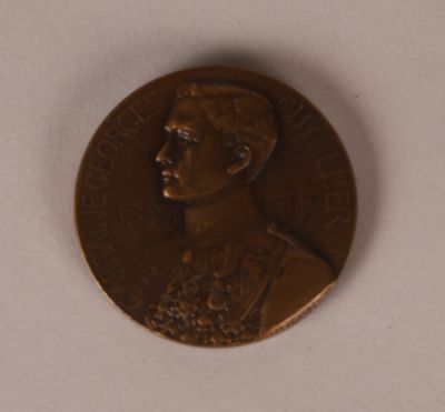 a close up of a coin with a picture of a man on it
