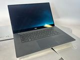 two laptops sitting on top of each other on a table