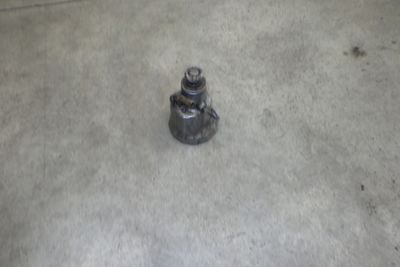 a small metal object on the ground in the garage