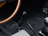 the interior of a car with a steering wheel and a checkered cloth