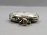an image of a close up of a silver watch on a table