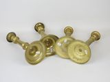 three brass plated candlesticks on a white background