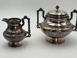 paire de théières anciennes en métal argenté, avec anses et poignées