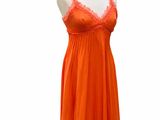 an orange dress on a mannequin display on a white background