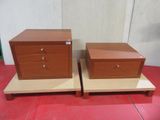 pair of nightstands with drawers on top of each other on a red tile floor