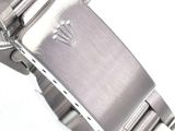 a watch that is sitting on a white surface