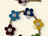 bracelet with multi colored flowers and pearls on a chain