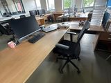 a desk with a computer and a monitor on it