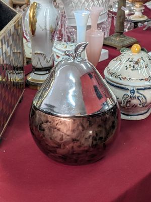 many vases and other decorative items on a table