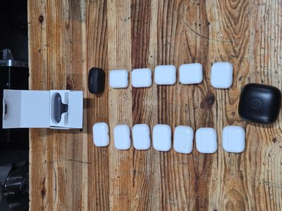 a picture of a wooden table with some white and black items on it