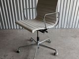 an office chair in front of a corrugated wall