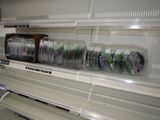 many toothbrushes on the shelves in the store
