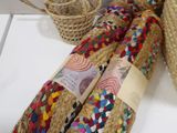 a basket that has a bunch of different colored ribbons on it