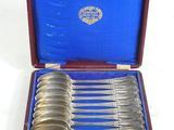silverware in a case with a blue cover and a red handle