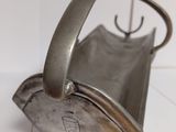 a silver tea kettle sitting on a white counter top