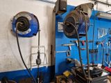 many tools hanging on the wall in the garage