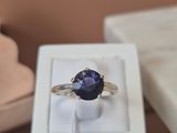 a ring that is sitting in a box on a table