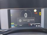 the dashboard of a car with a digital display on it