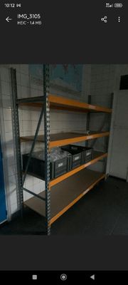 a picture of a room with shelves and a refrigerator in it