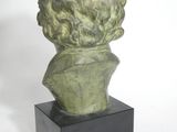 an image of a sculpture of a head on a black base
