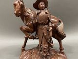 bronze statue of a man on a horse with a hat on his head