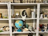 a shelf with a globe on top of it