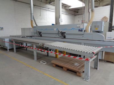 an image of a machine that is cutting wood in a factory