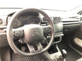 the interior of a car with a steering wheel and dashboard controls