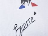 a close up of a white t shirt with a logo on it