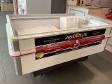 a large ice cream machine in the middle of a kitchen