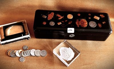 a small box with coins and a small box with a picture on it