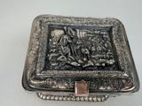 a silver box with a picture of a man and a woman on it