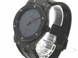 a watch that is sitting on a white surface
