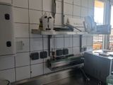 an image of a kitchen with a sink and a refrigerator