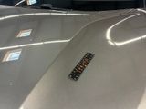 a close up of a car with a sticker on the hood