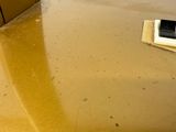 a dirty floor with a phone on it in the middle of the room