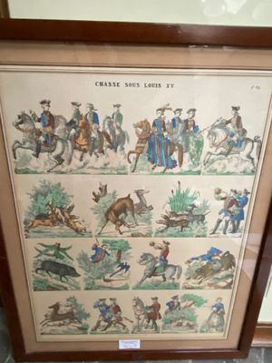 two framed pictures of horses and riders on display