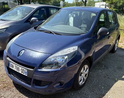 two small cars parked next to each other in a parking lot