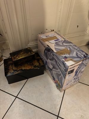 two boxes that are sitting on the floor next to each other