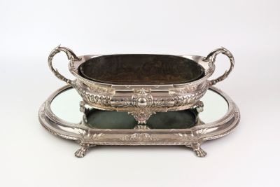 a silver tray with a mirror on top of it