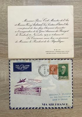an old envelope with a stamp on it sitting on top of a wooden table
