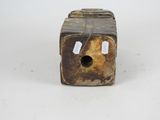 a small wooden box with a tag on it