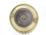 a brass plate with a circular design on it